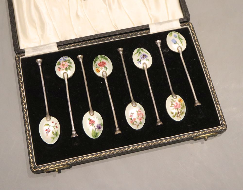 A cased set of eight silver and enamel coffee spoons, Henry Clifford Davis, Birmingham, 1957, gross 78 grams.